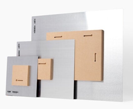 Metal wall print mounted with a wooden block creating a floating effect on the wall